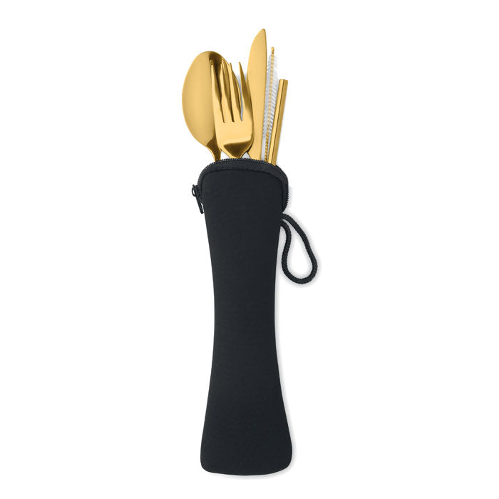 Gold cutlery set in a black pouch on a white background