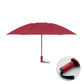 Red umbrella with a close-up of the handle on a white background