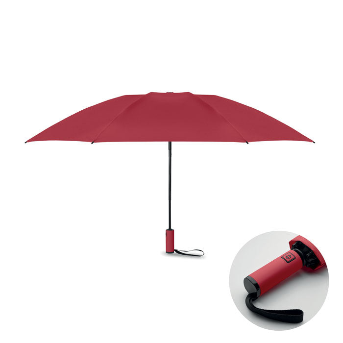Red umbrella with a close-up of the handle on a white background