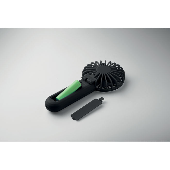 Black handheld hair dryer with green handle on a gray background