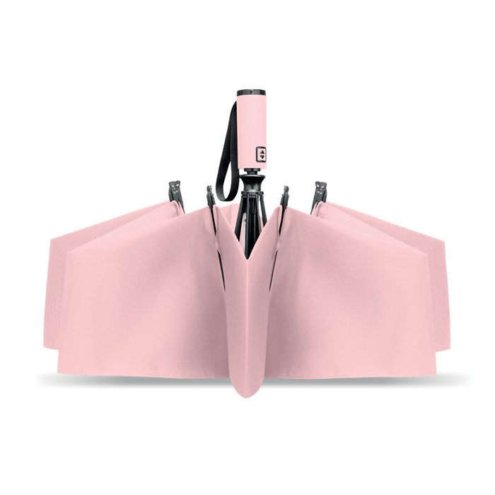 Pink umbrella with a black handle on a white background