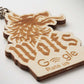 Wooden keychain with engraved text and design on a white background