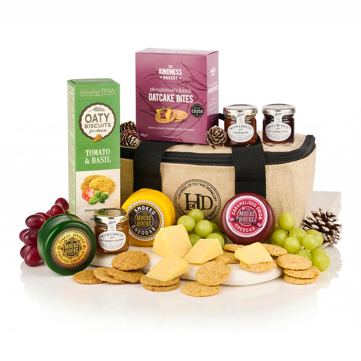 Cheese Cool Bag Hamper with three Mouse House cheddars, three Tiptree chutneys, oatcake bites and tomato biscuits around a jute cool bag