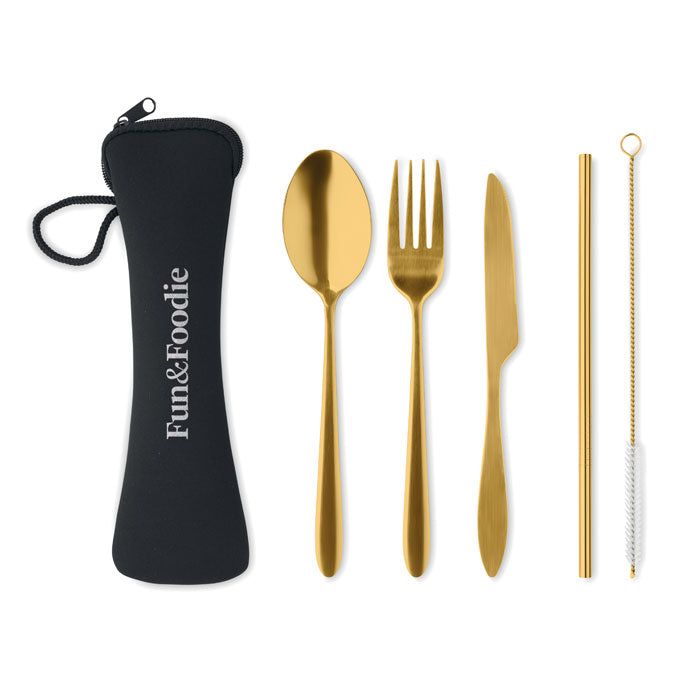 Gold cutlery set with a black carrying case labeled 'Funk & Foodie' on a white background.