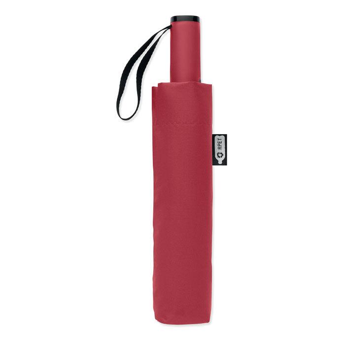 Red umbrella with a black handle on a white background