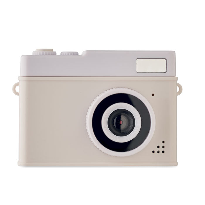 Beige camera with a black lens on a white background