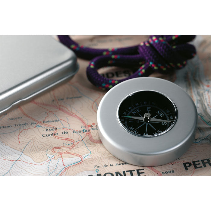 Branded Nautical Compass in Tin Box in use