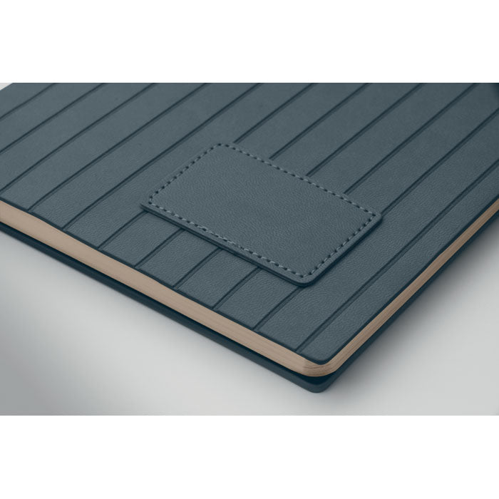 Blue textured notebook with a pocket on a white background