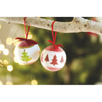 Branded pearl Christmas bauble, on the tree