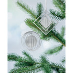 Branded circle decoration with ribbon, on the tree