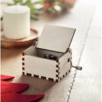 Branded wooden Christmas music box, in use