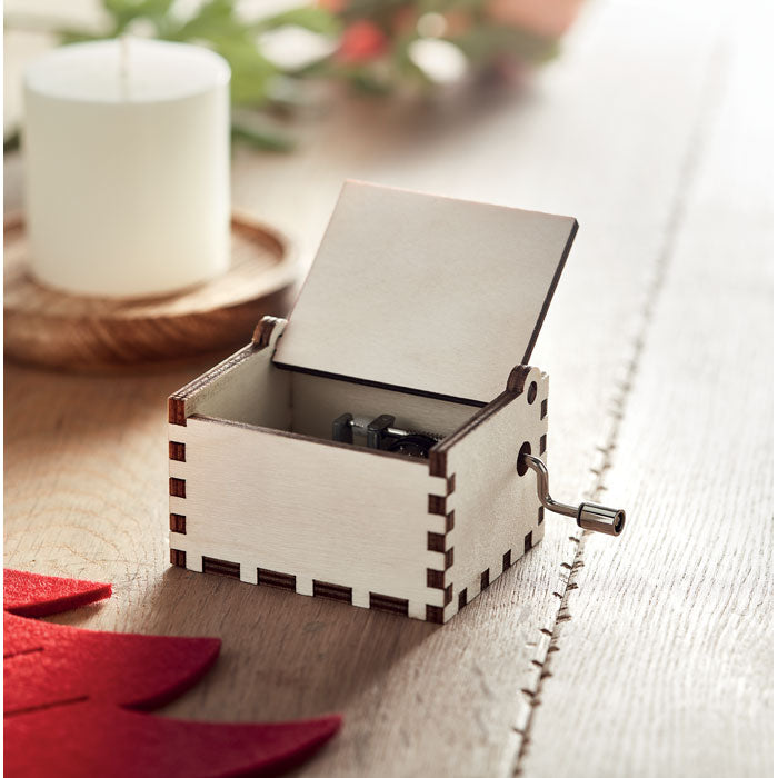 Branded wooden Christmas music box, in use