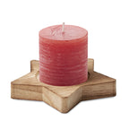 Branded star candle on wooden base
