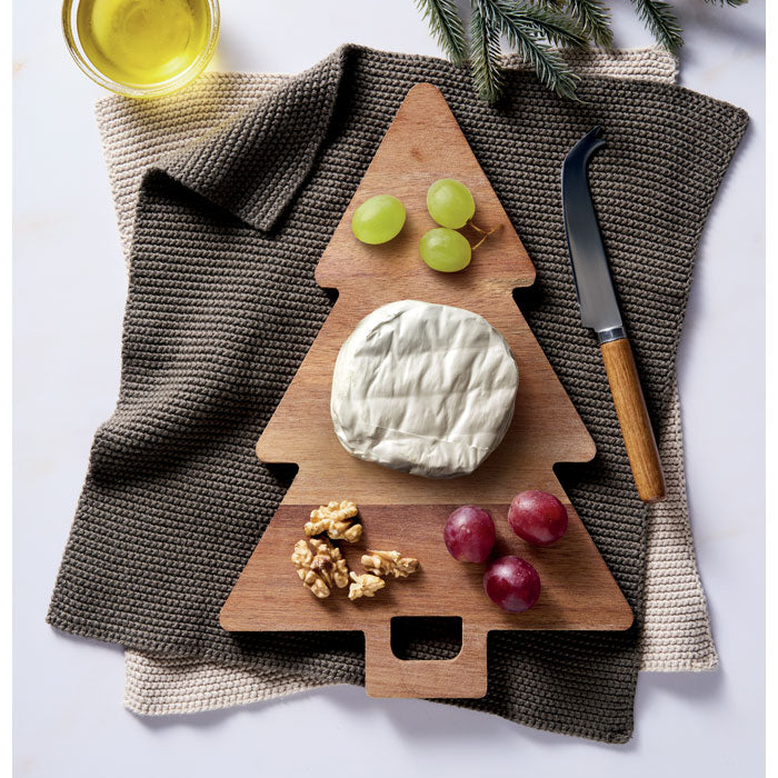 Branded acacia Christmas tree serving board, in use