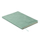 Mint green notebook with a textured cover on a white background