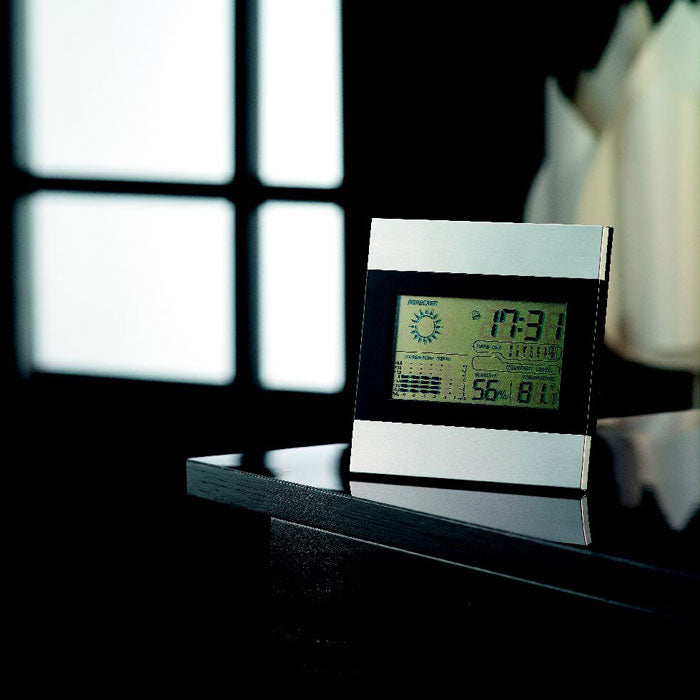 Branded Black and Silver Weather Station in use