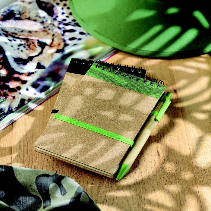 Branded A6 Recycled Paper Notebook with Pen in use