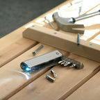 Branded Multi-Tool Holder with LED Torch in use