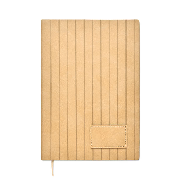 Beige notebook with a textured cover on a white background