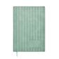 Green notebook with textured cover on a white background