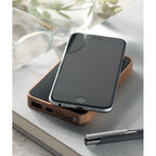 Branded Acacia Wood Wireless Power Bank in use