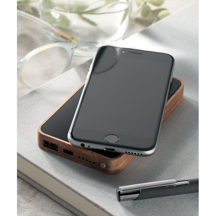 Branded Acacia Wood Wireless Power Bank in use