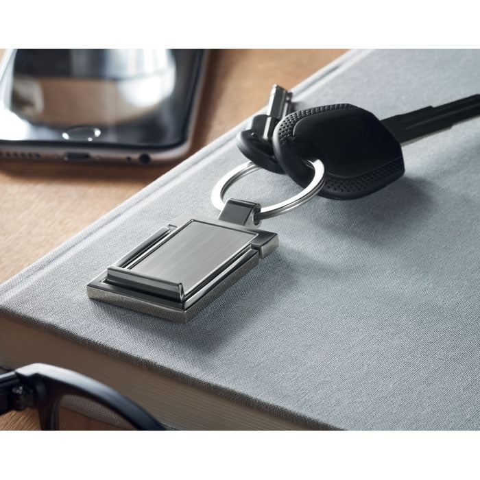 Branded Metal Key Ring Phone Stand in use