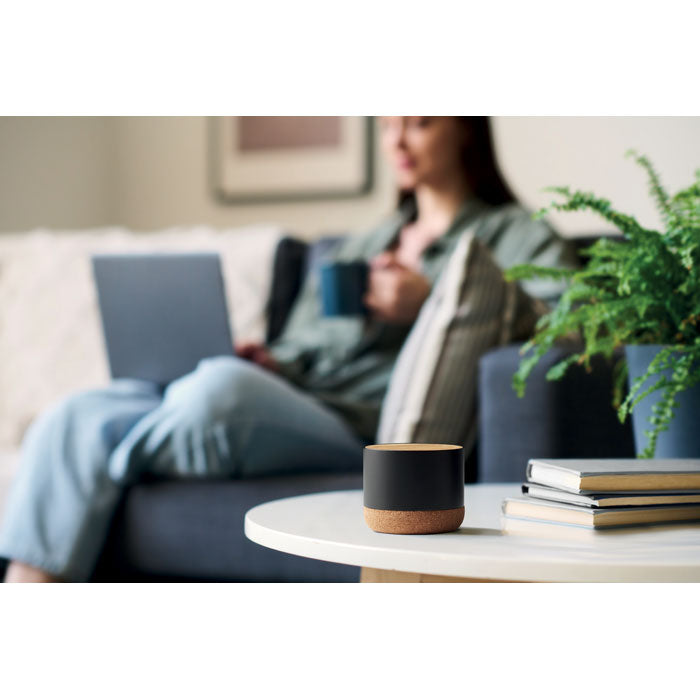 Branded Cork and Aluminium Wireless Speaker in use