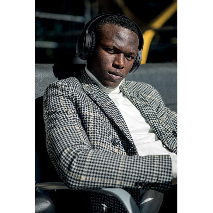 Branded Noise Cancelling Foldable Headphones in use