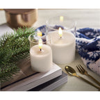 Branded LED Wax Candle in Glass Holder in use