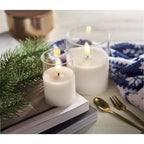 Branded LED Wax Candle in Glass Holder in use