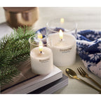 Branded LED Wax Candle in Glass Holder in use