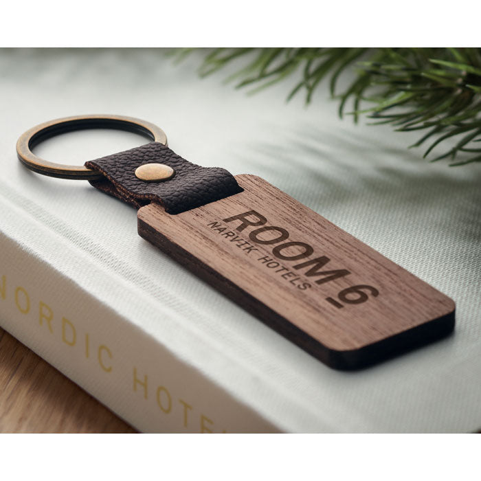 Branded Walnut and PU Key Ring in use