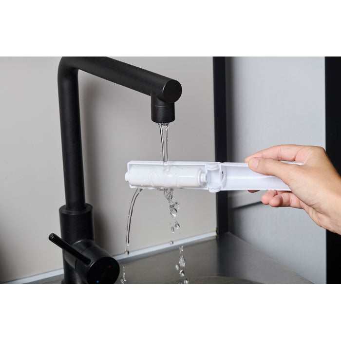 Branded Reusable Sticky Roller Cleaner in use