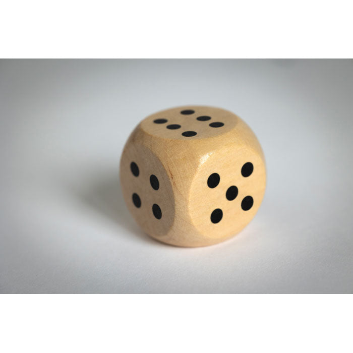 Branded Schima Wood Dice - 3cm in use