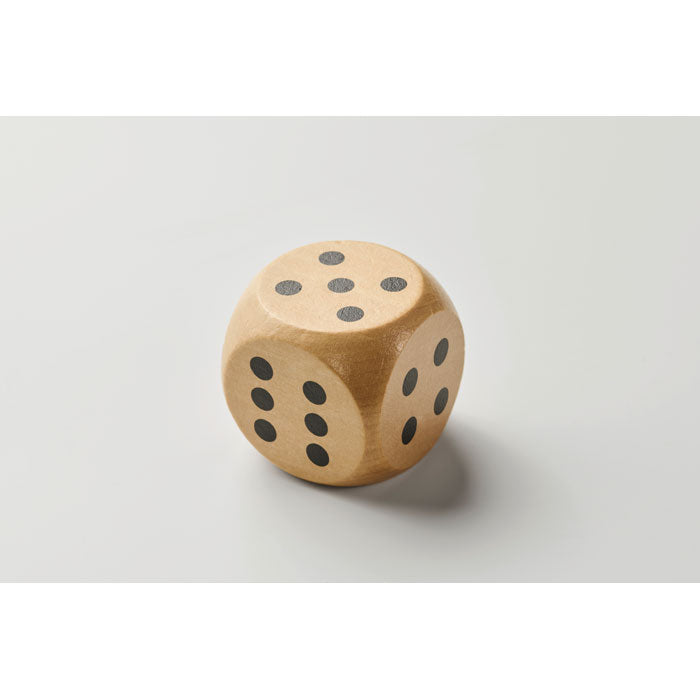 Branded Schima Wood Dice - 5cm in use