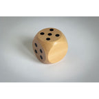 Branded Schima Wood Dice - 5cm in use