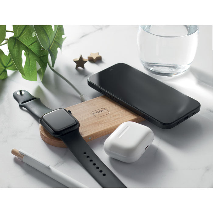 Branded Bamboo 3 in 1 Wireless Charging Station in use