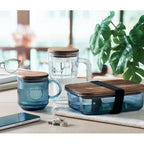 Branded Ribbed Glass Mug with Acacia Lid in use