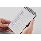 Branded Water Repellent Notepad with Pen in use