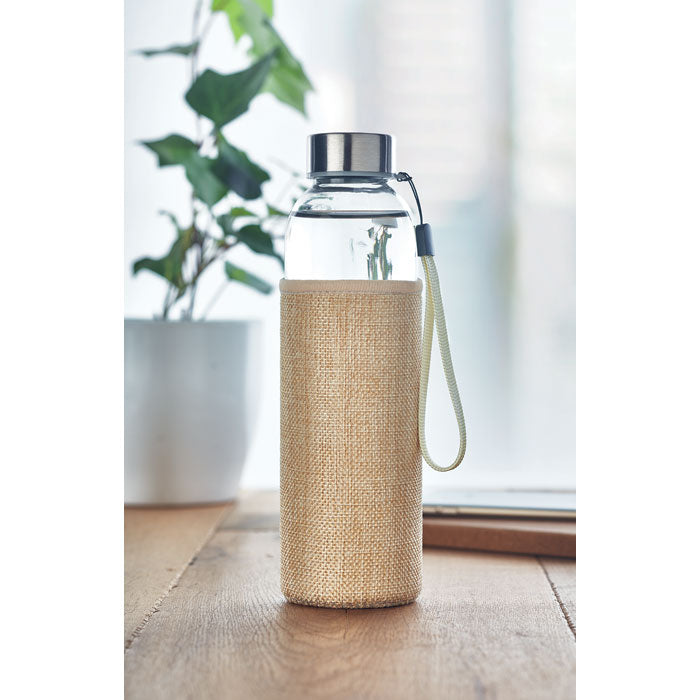 Branded glass bottle, in use