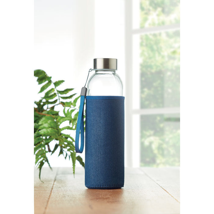 Branded glass bottle, in use