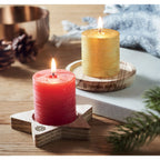 Branded Candle on Round Wooden Base in use