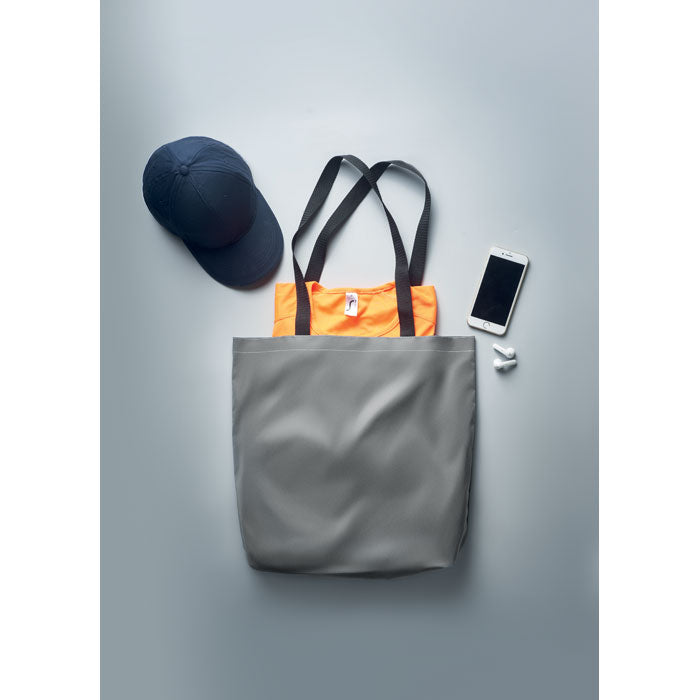 Branded Reflective Shopping Bag in use