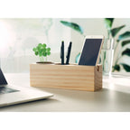 Branded Wooden Desk Stand with Clover Seeds in use
