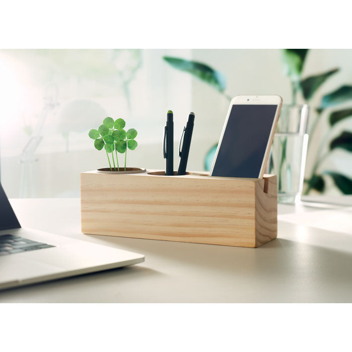 Branded Wooden Desk Stand with Clover Seeds in use