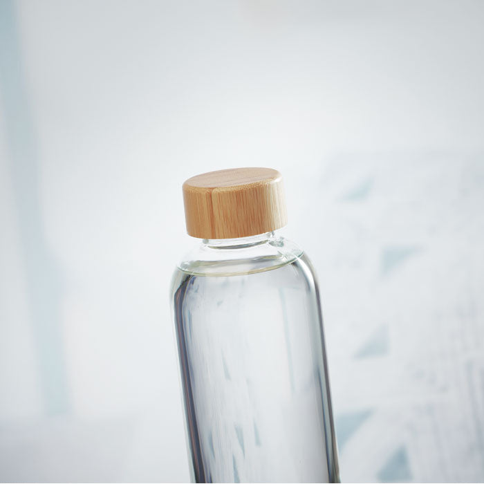 Branded glass bottle, in use