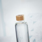 Branded Glass Bottle with Bamboo Lid - 650ml in use