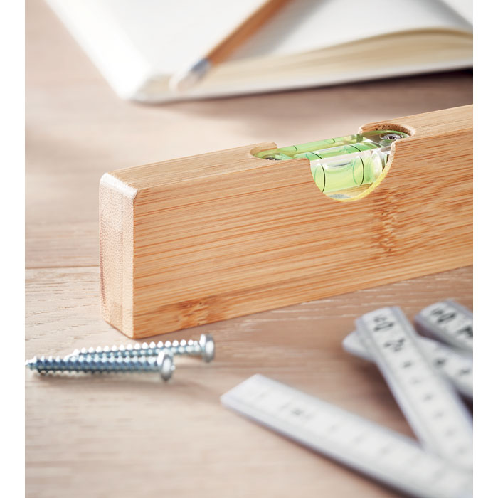 Branded Bamboo Spirit Level with Bottle Opener in use