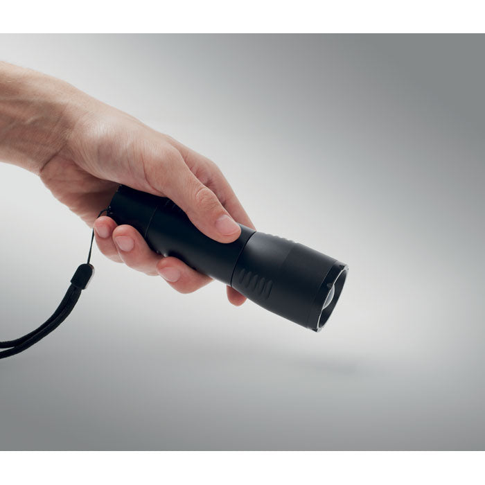 Branded Small Aluminium Zoomable LED Flashlight in use